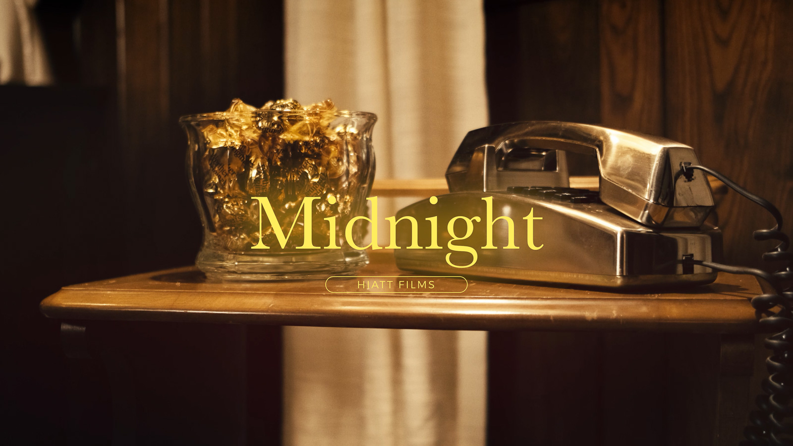 Cinematic live event speaker presenting on stage with dramatic lighting, filmed by Hiatt Films