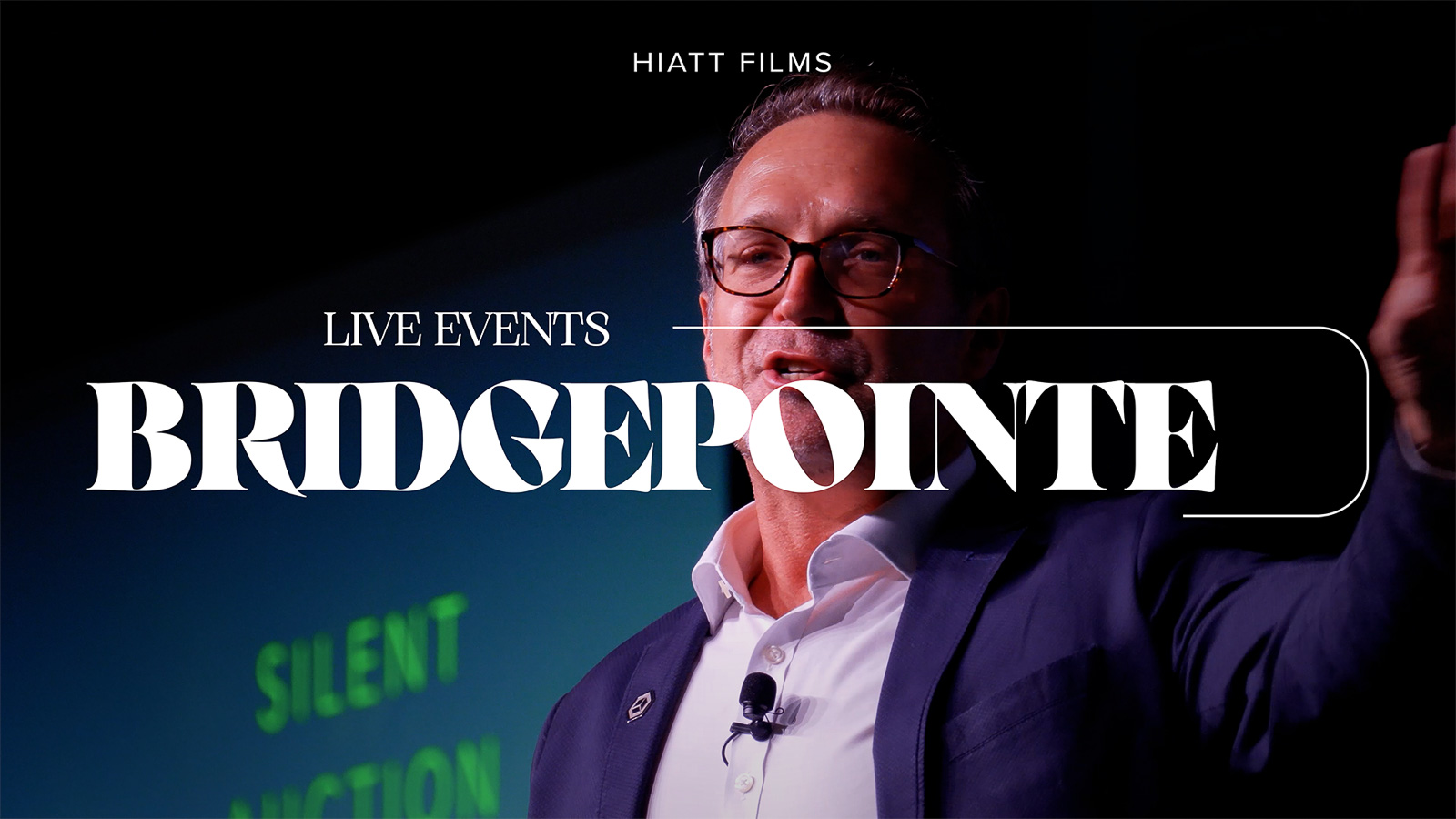 Live event speaker presenting on stage during corporate conference filmed by Hiatt Films