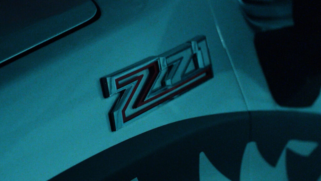 Cinematic close-up of a vehicle badge under low light conditions, filmed by Hiatt Films